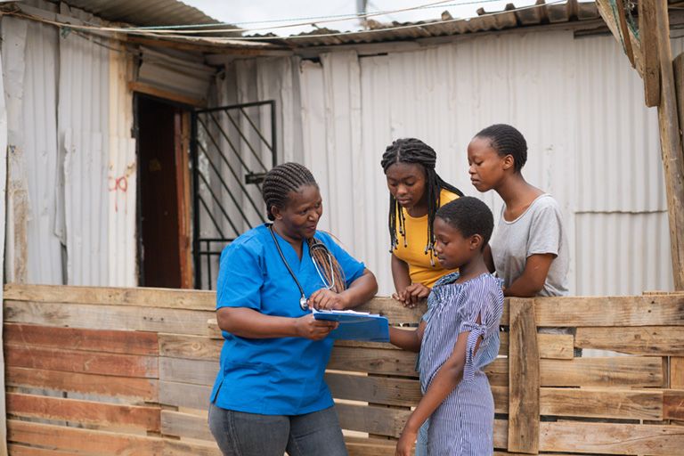 Doctor talking with a group of people