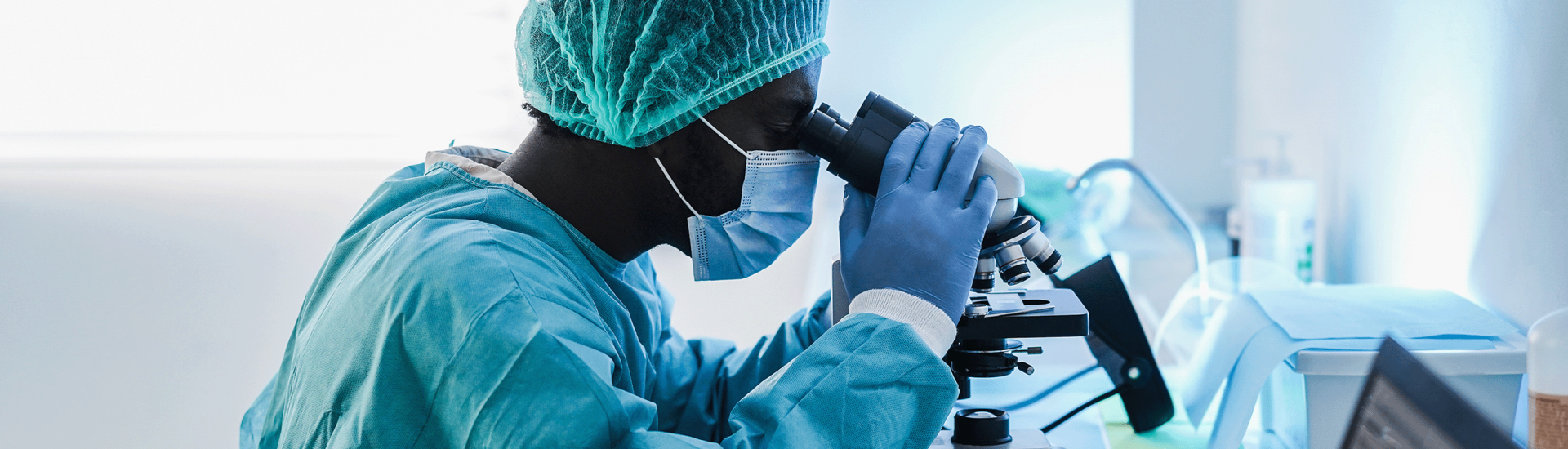 Man looking through Microscope